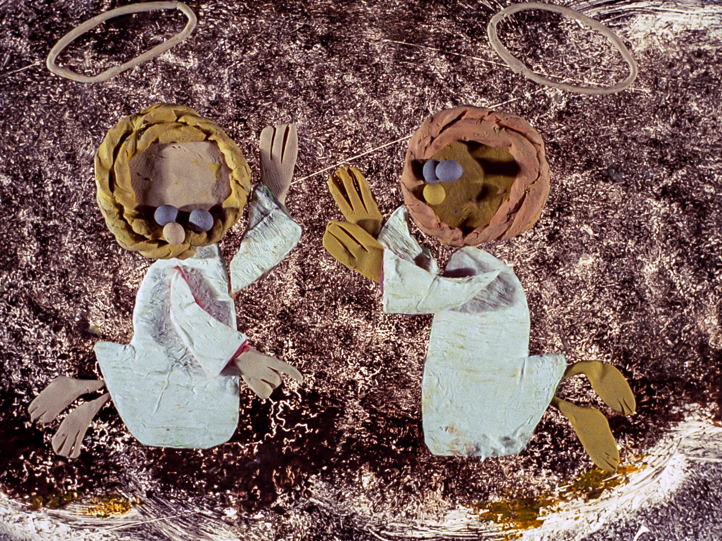 two plasticine angels in a cloud